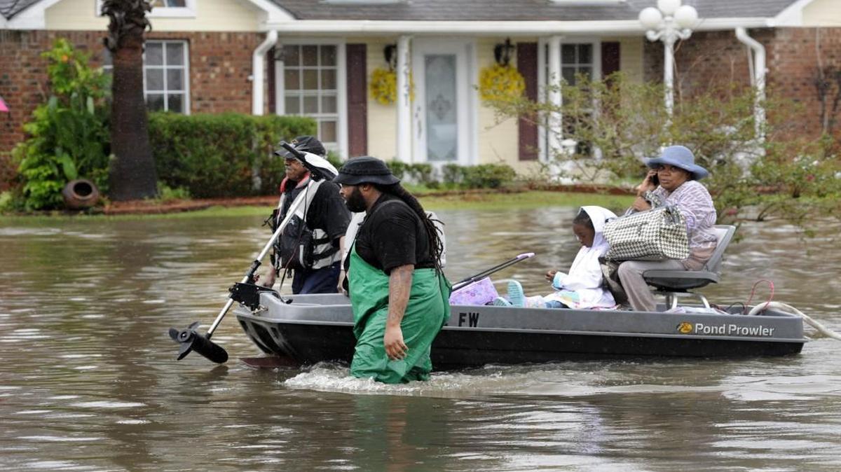 Volunteers pulled a boat with a woman and child as they evacuated their homes from flooding last weekend in Baton Rouge, La.