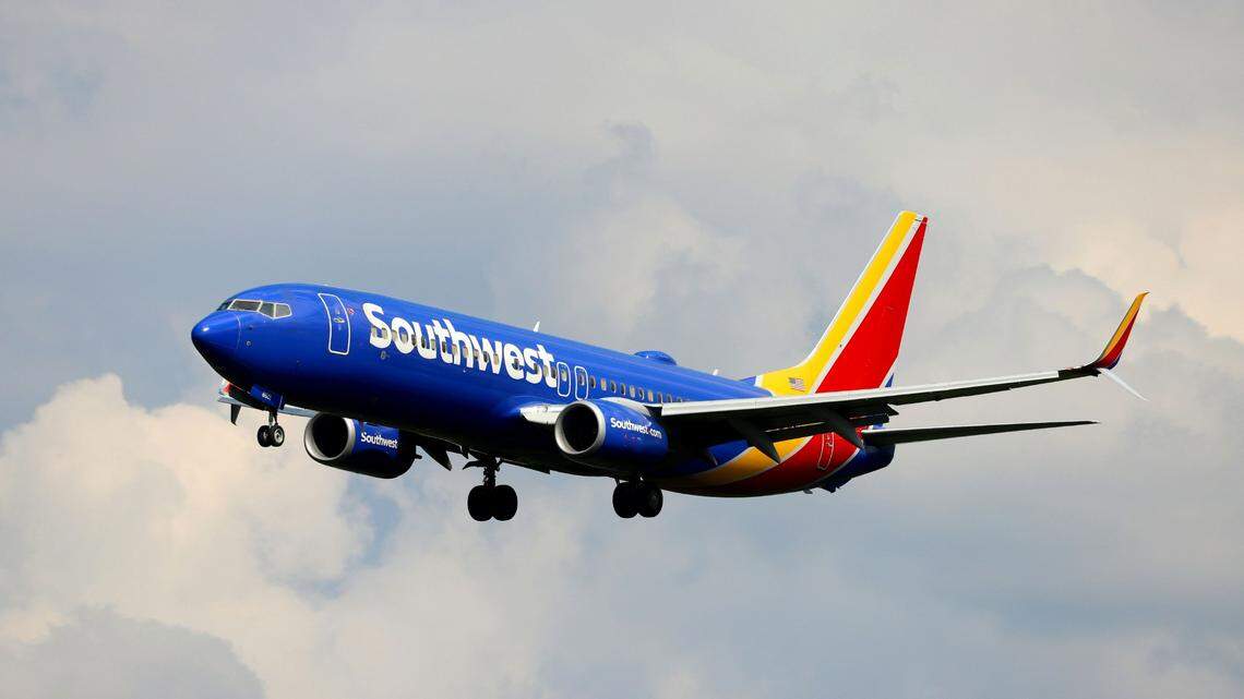 Southwest passenger tries to open plane door mid-air and is restrained, feds say