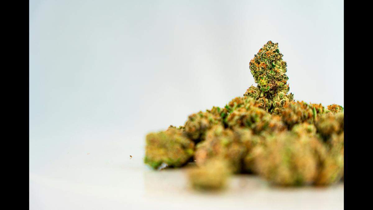 The superintendent for a Michigan school district is accused of smoking marijuana with an administrator during school hours, officials say.