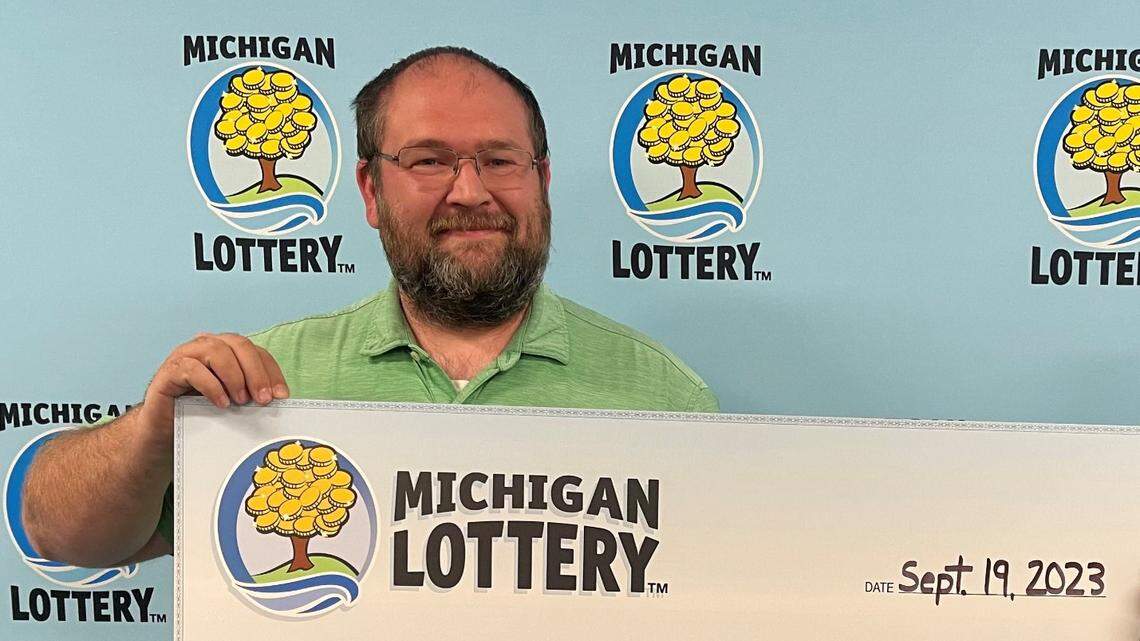 Nicholas McCreary with his oversized check.