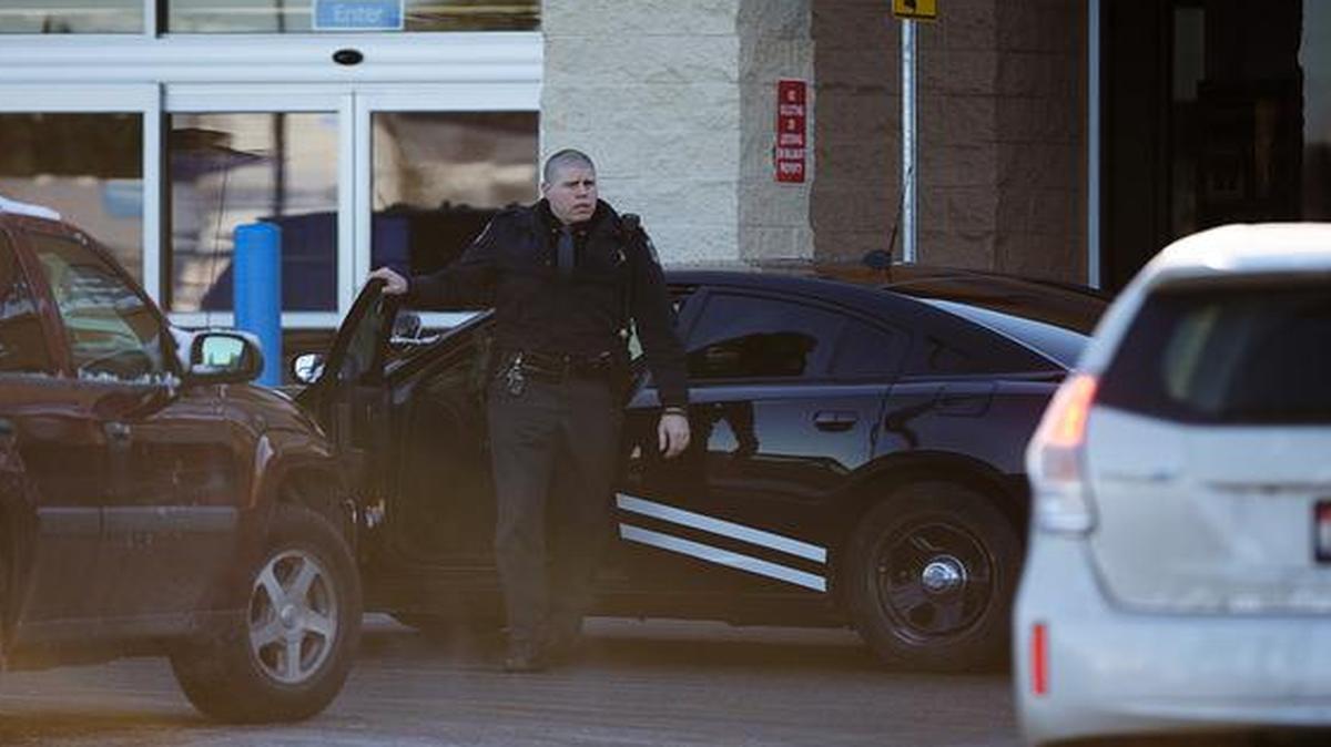 
An Idaho State Patrol officer arrives at the Wal-Mart in Hayden, Idaho, Tuesday
