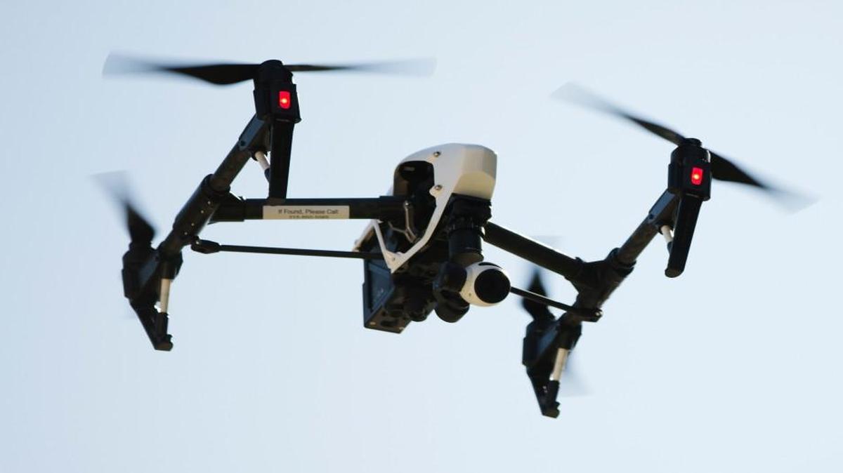 A drone captures videos and still images of an apartment building in Philadelphia. Routine commercial use of small drones was cleared for takeoff by the Obama administration on Tuesday after years of struggling to write rules that would both protect public safety and free the benefits of a new technology.