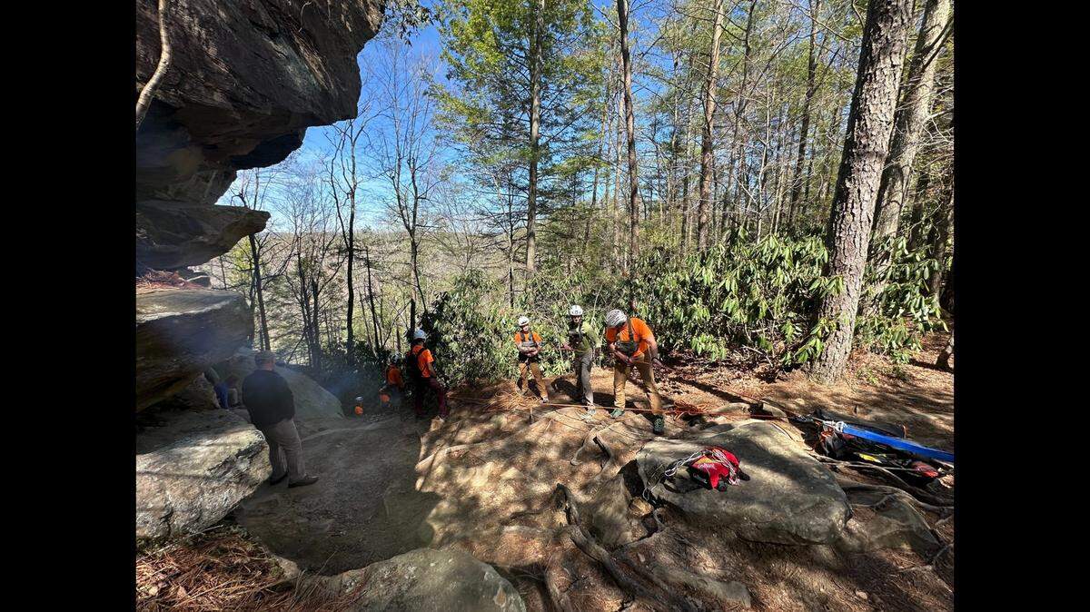 Rescuers used ropes to rappel to the hiker, who was trapped along a cliff face at the Red River Gorge Geological Area in Kentucky.