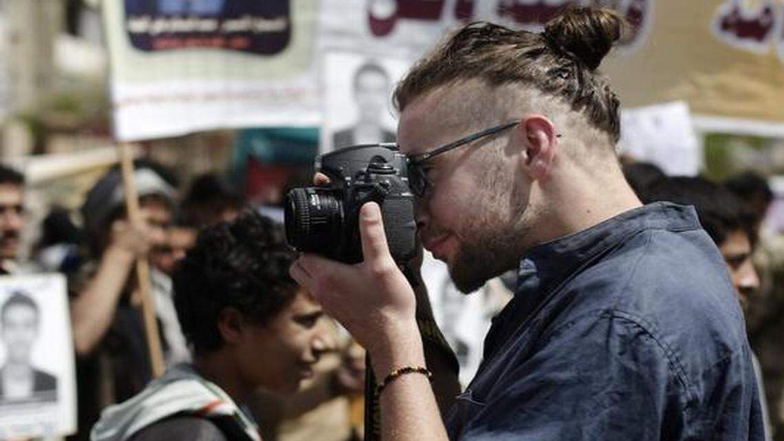 
In this April 16, 2013, file photo, Luke Somers, 33, photographed a demonstration demanding the release of Yemeni detainees in Guantanamo Bay prison in front of the U.S. Embassy in Sanaa, Yemen. Somers and a South African teacher held captive by al-Qaida militants in Yemen were killed Saturday during a U.S.-led rescue attempt.
