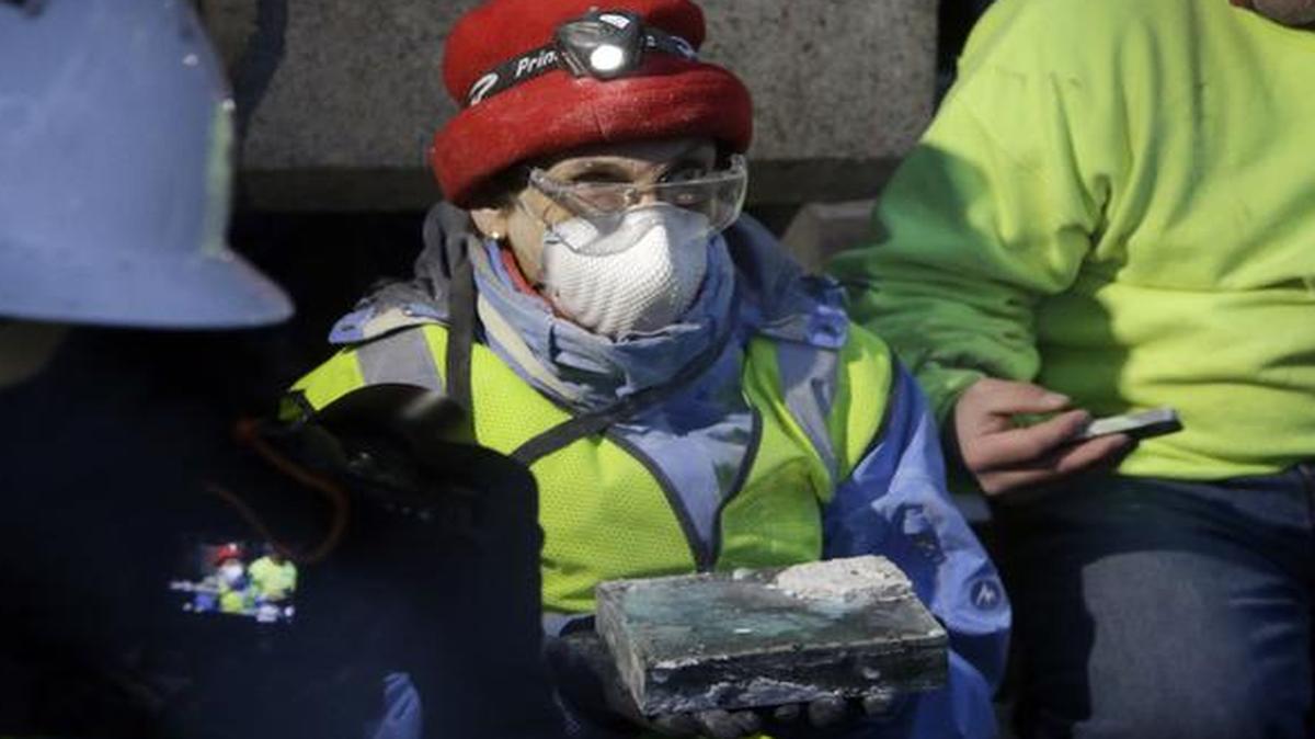 
Pamela Hatchfield, a conservator at the Boston's Museum of Fine Arts, holds a time capsule she had just removed from the cornerstone of the Statehouse in Boston
