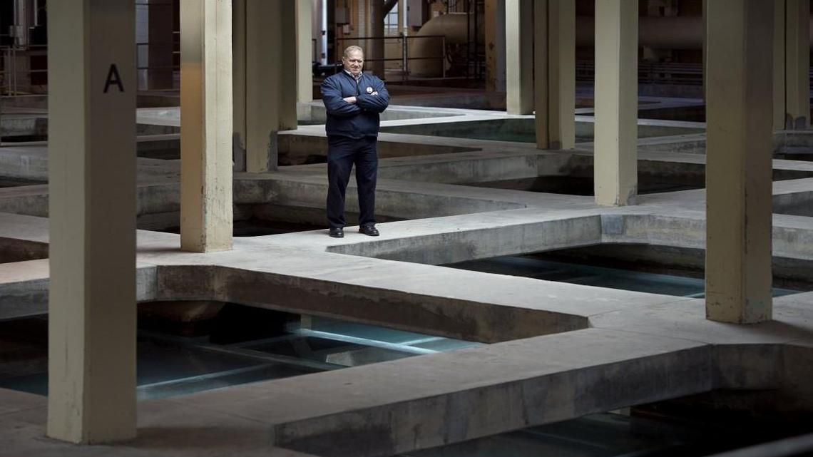 Plant manager Michael Klender oversees the quality of water coming from the Kansas City Water Services facility at 1 N.W. Briarcliff Road. Here he stands above sand filters, one of the final steps before the water is sent on to customers.