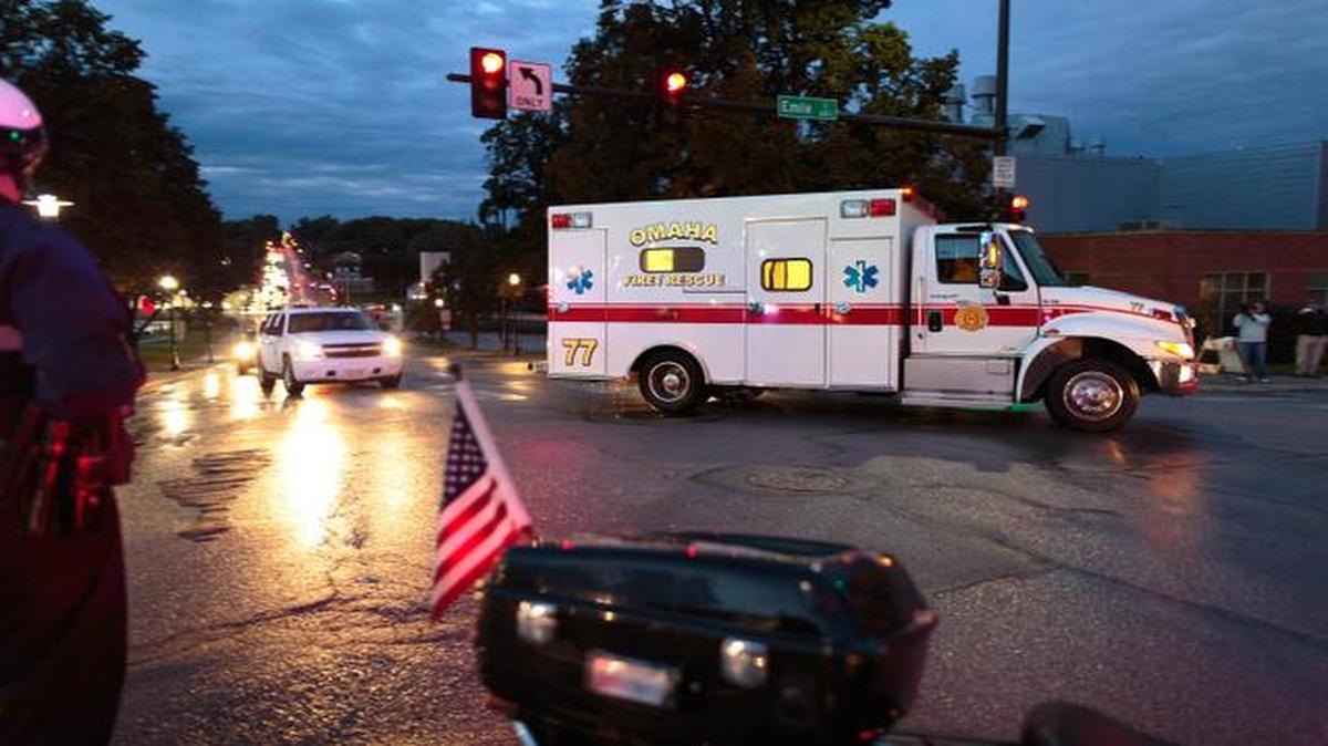 
The ambulance transporting Dr. Rick Sacra, 51, who was infected with Ebola while serving as an obstetrician in Liberia arrives escorted by police vehicles to the Nebraska Medical Center in Omaha, Neb., Friday, Sept. 5, 2014. 
