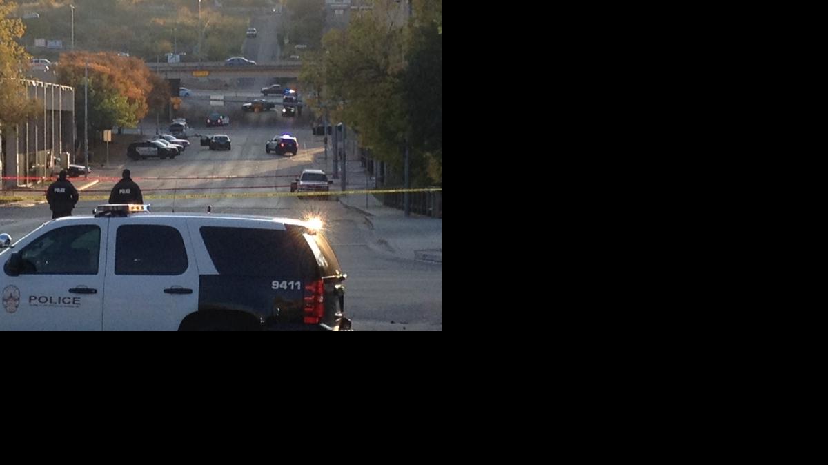 
Police tape marks off the scene after authorities shot and killed a man who they say opened fire on the Mexican Consulate, police headquarters and other downtown buildings in Austin, Texas
