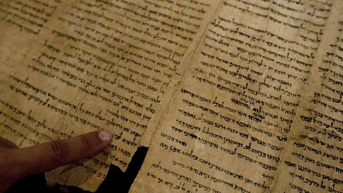 Researchers are trying to determine the connection between the Dead Sea Scrolls and 33 human skeletons unearthed last year in the Judean Desert near where the scrolls were found.