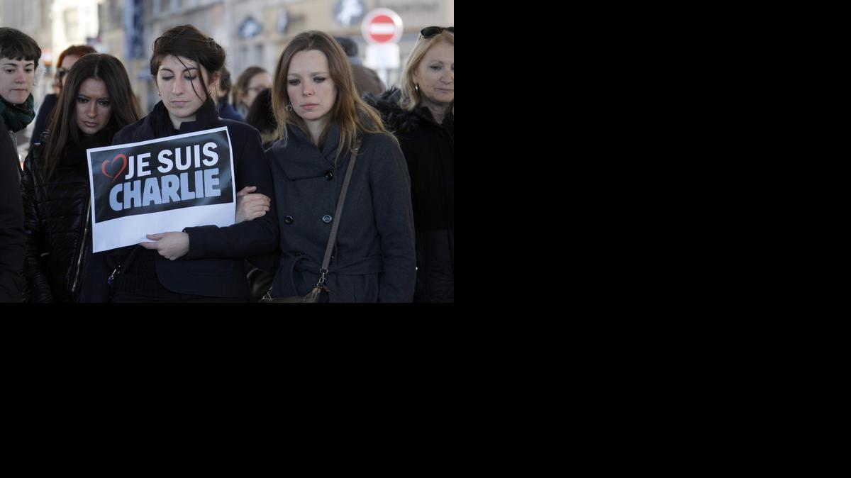 
People pay tribute to the victims of the satirical newspaper “Charlie Hebdo,” in Marseille, southern France, Thursday.
