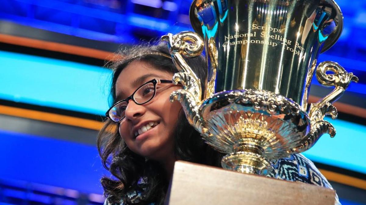Ananya Vinay, 12, from Fresno, Calif., holds her trophy after being declared the winner of the 90th Scripps National Spelling Bee, in Oxon Hill, Md., on Thursday.