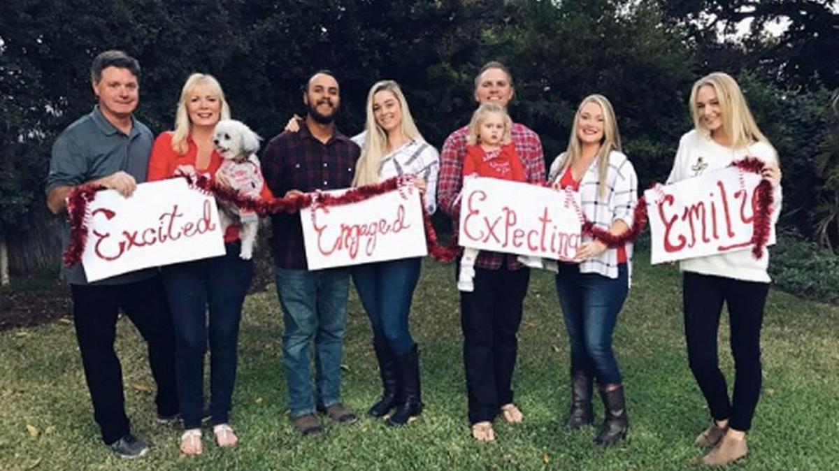 Emily Seawright of California joked about her single status in her family’s Christmas photo and now thousands of other single people are laughing with her.