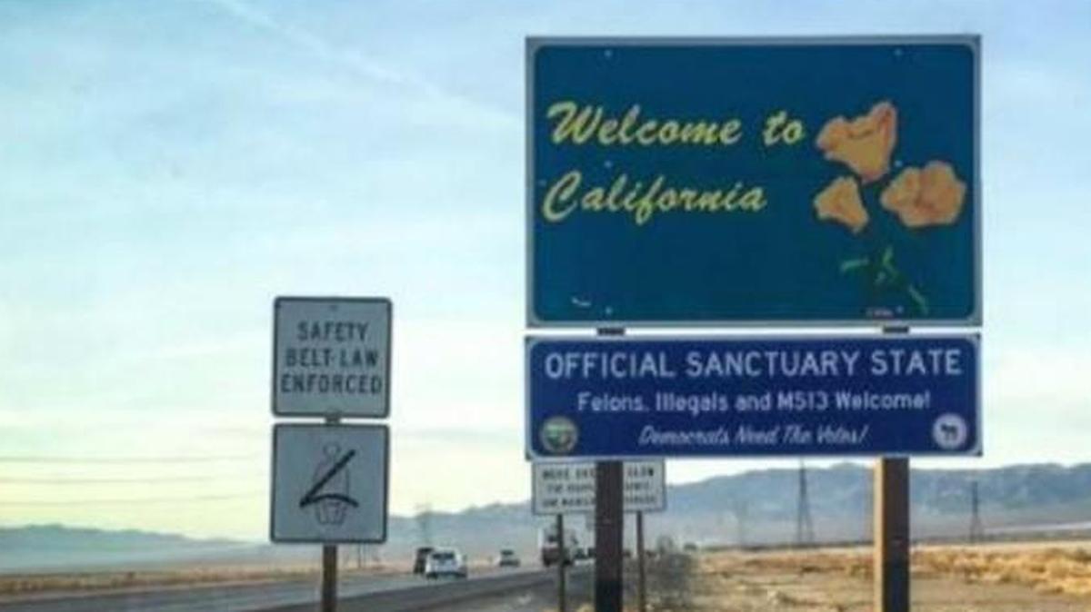 Fake road signs in California welcome “Felons, Illegals” into an “Official Sanctuary State.” The signs also say, “Democrats Need The Votes!”