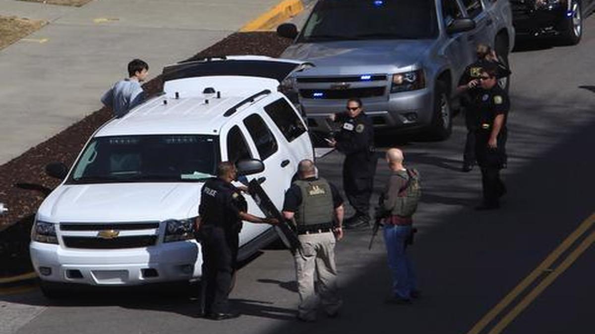 
Law enforcement officials gathered on the campus of the University of South Carolina in Columbia, S.C., after shots were fired Thursday at its School of Public Health.
