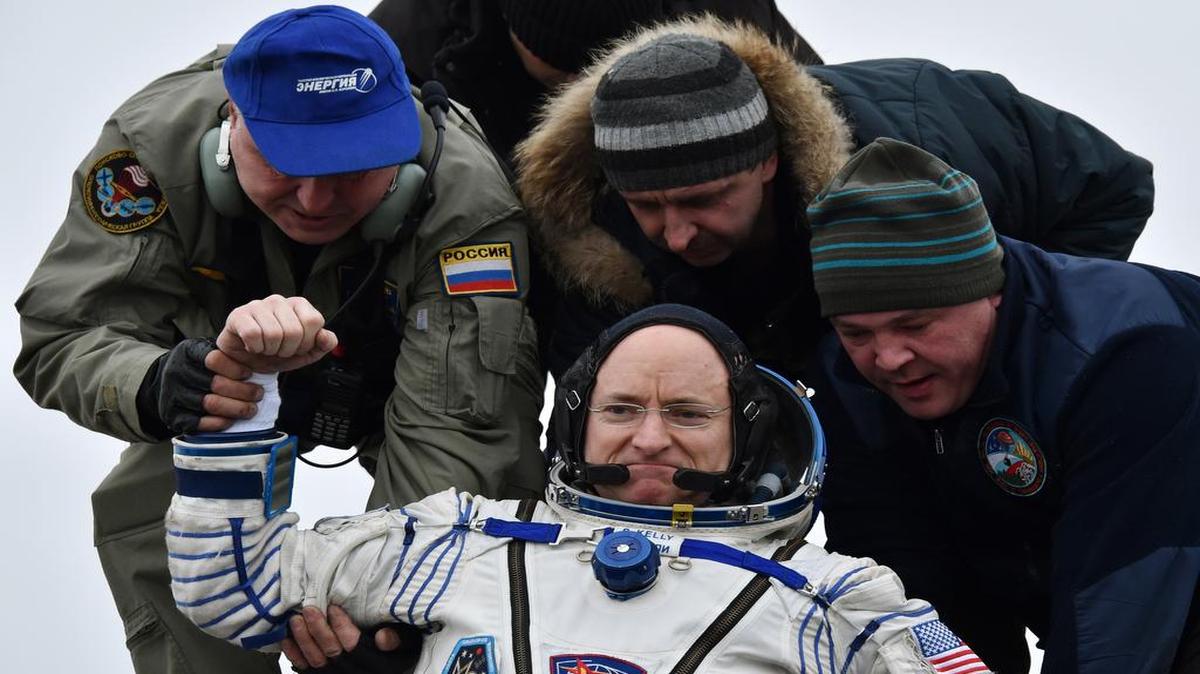 Ground personnel helped International Space Station crew member Scott Kelly of the U.S. get off the Soyuz TMA-18M space capsule after landing near the town of Dzhezkazgan, Kazakhstan. Kelly and Russian cosmonaut Mikhail Kornienko returned to Earth on Wednesday after spending almost a year in space in a groundbreaking experiment foreshadowing a potential manned mission to Mars.