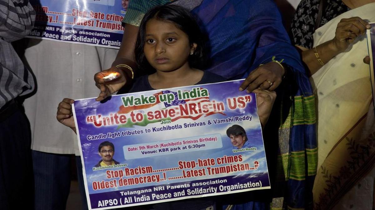 A girl joined parents of Indians living abroad and others in a candlelight vigil Thursday to pay tribute to Srinivas Kuchibhotla in Hyderabad, India. Kuchibhotla, a 32-year-old engineer, was killed in a shooting last month in a crowded Austins Bar & Grill in Olathe.