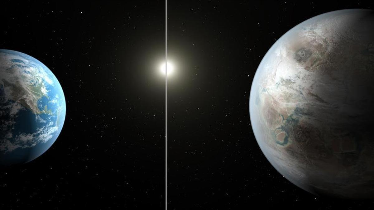 
This artist's rendering made available by NASA on Thursday shows a comparison between the Earth (left) and the planet Kepler-452b. 
