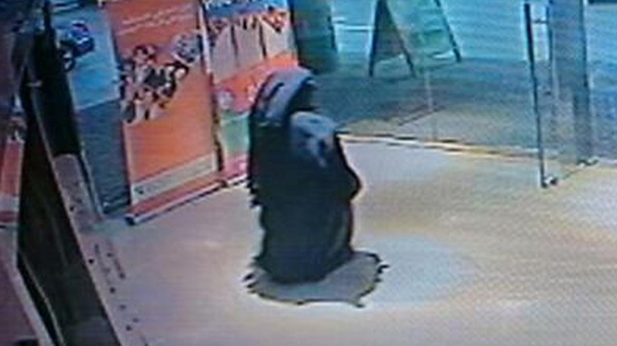 
This image made from video shows a veiled suspect in the stabbing of an American teacher in a shopping mall restroom 
