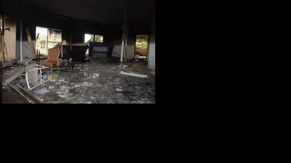 
This Sept. 12, 2012 file photo shows glass, debris and overturned furniture are strewn inside a room in the gutted U.S. consulate in Benghazi, Libya, after an attack that killed four Americans, including Ambassador Chris Stevens.
