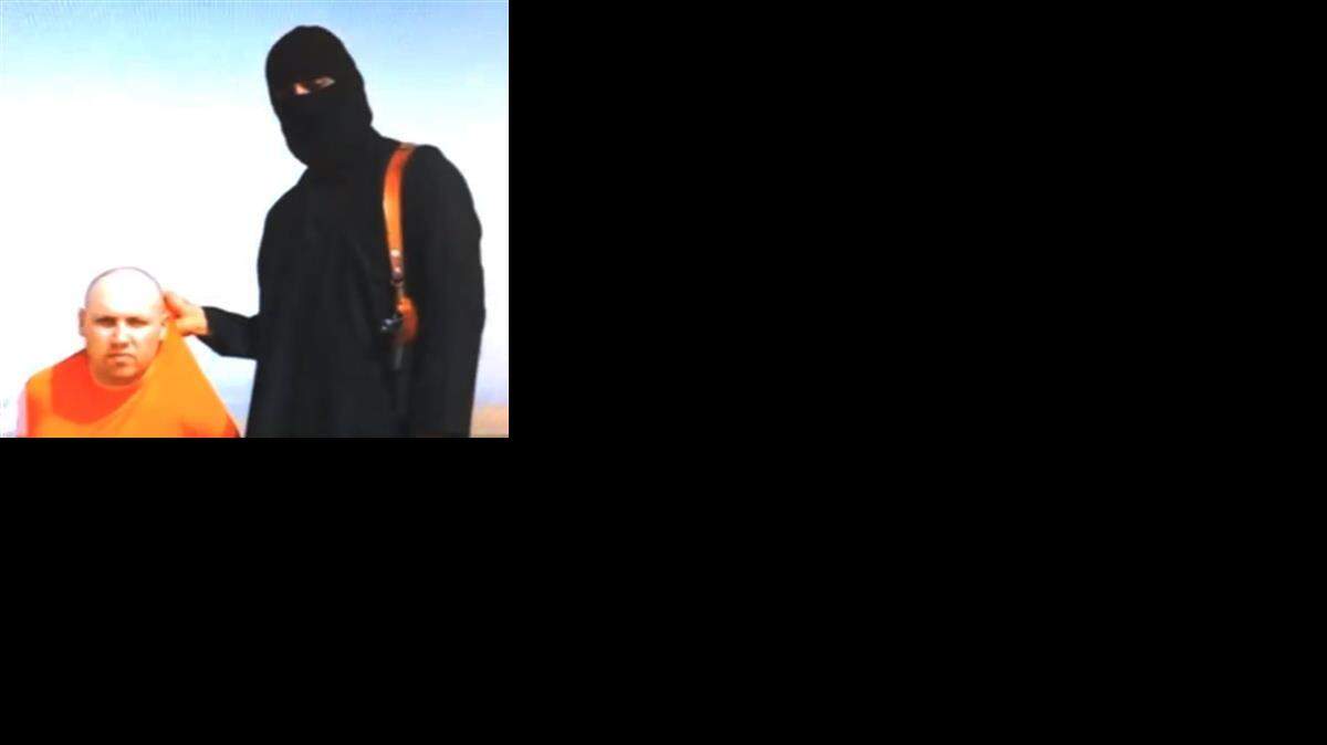
This still image from an undated video released by Islamic State militants on Tuesday, Aug. 19, purports to show journalist Steven Sotloff being held by the militant group.
