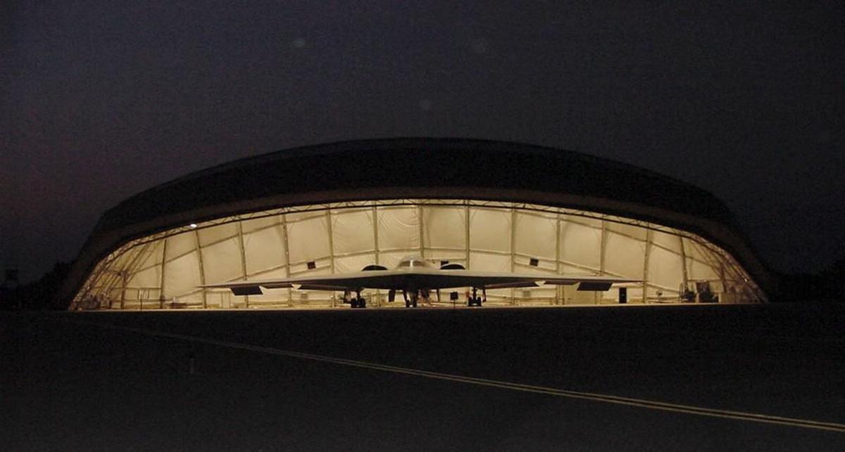 This 2001 photo shows a B-2 stealth bomber in a portable hangar tested at Whiteman Air Force Base near Knob Noster, Mo. Typhoon-proof hangars engineered by Kansas City firm Burns & McDonnell were built on the Pacific island of Guam more than 10 years ago and the planes have regularly deployed for training missions to that U.S. territory.