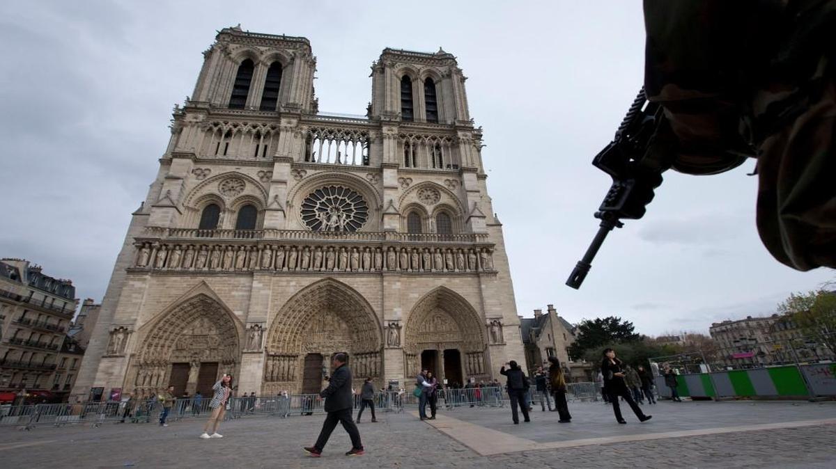 Three days after the rampage of terror attacks in Paris, a soldier patrolled Monday at Notre Dame cathedral in the French capital.