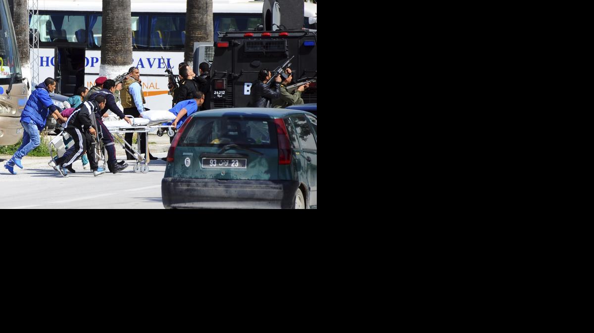 
Rescue workers pull a stretcher outside the Bardo museum Wednesday in Tunis, Tunisia. 
