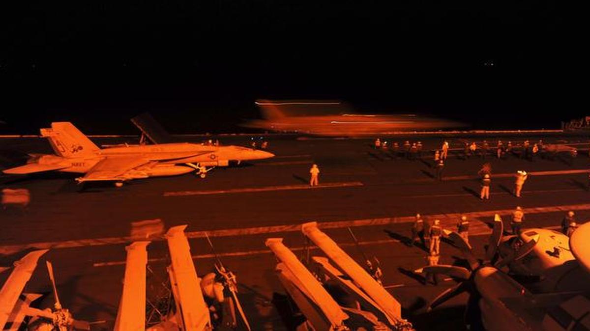 
An A-18E Super Hornet and an F/A-18F Super Hornet, attached to Strike Fighter Squadron (VFA) 213, prepare to launch from the flight deck of the aircraft carrier USS George H.W. Bush 
