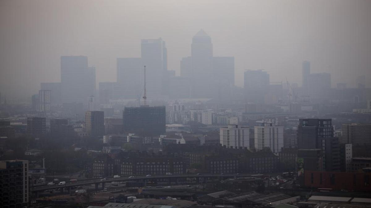 London’s overreliance on diesel-powered vehicles brought on by decades of government incentives has had just the opposite effect, as seen in this 2014 file photo of the Canary Wharf business district skyscrapers shrouded in smog.