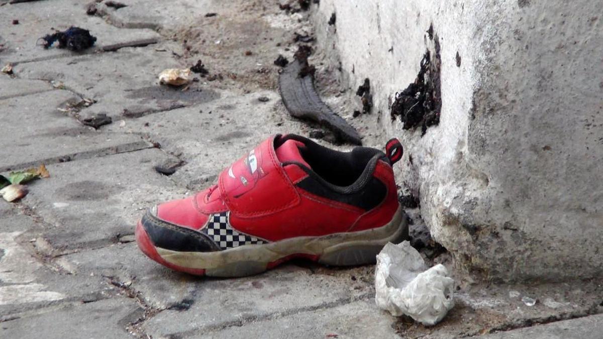 The shoe of a young victim and a piece of metal lay near the scene just hours after Saturday’s bomb attack in Gaziantep, southeastern Turkey targeting an outdoor wedding party.