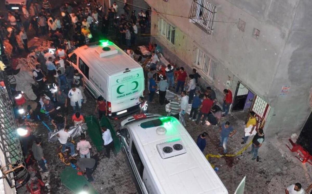 People carried bodies into ambulances Sunday after a suicide bombing in Gaziantep, Turkey, at an outdoor wedding party that killed dozens. Turkish authorities suspect the bomber was a boy aged 12 to 14.