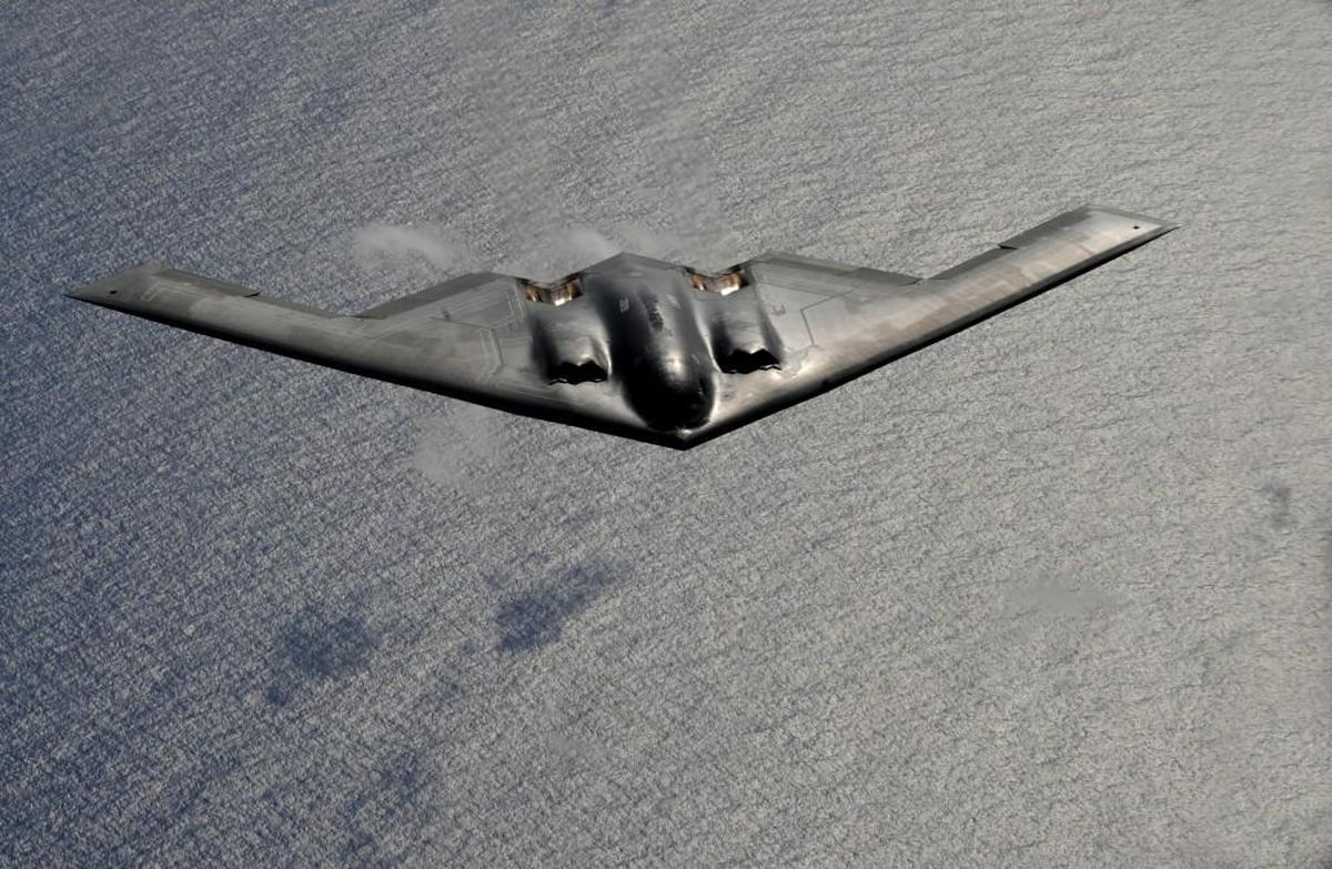 A B-2 Spirit from Whiteman Air Force Base flies over the Pacific Ocean during a mission exercise from Guam.