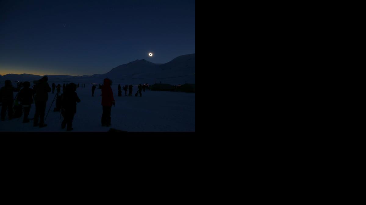 
People view the total solar eclipse in Svalbard, Norway Friday 
