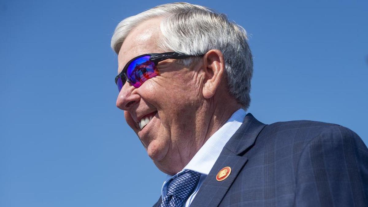 Missouri Governor Mike Parson greets people in Kansas City in June 2021. As the delta variant of the COVID-19 virus has taken hold in Missouri, the governor is encouraging vaccinations but hasn’t adopted a more assertive  tone of some other leaders.