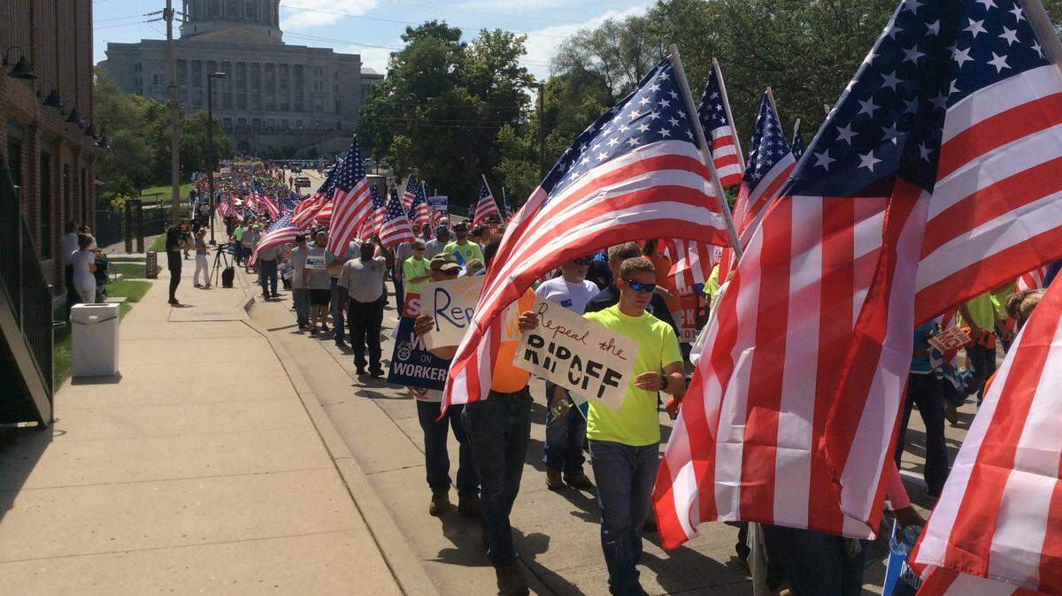 Opponents of right to work marched to the Missouri secretary of state's office in August 2017 to drop off petitions seeking a vote to repeal the law.