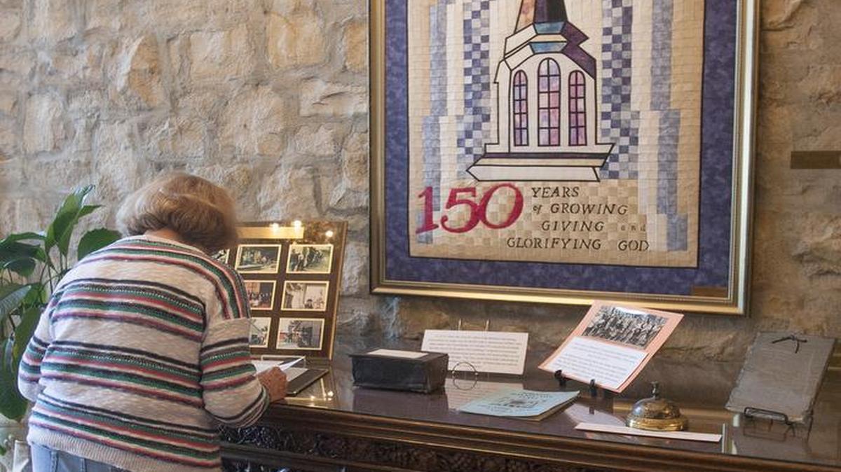 
Jan Hammers, who has lived in the neighborhood near First Baptist Church for more than 50 years, stopped in Saturday to read some of the church’s history. 
