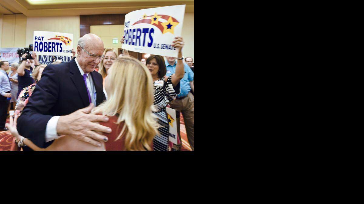 U.S. Sen. Pat Roberts greeted supporter Vicki Sciolaro after Roberts defeated tea party challenger Milton Wolf in the Kansas Republican primary for the U.S. Senate on Tuesday night at a watch party at the Overland Park Marriott.