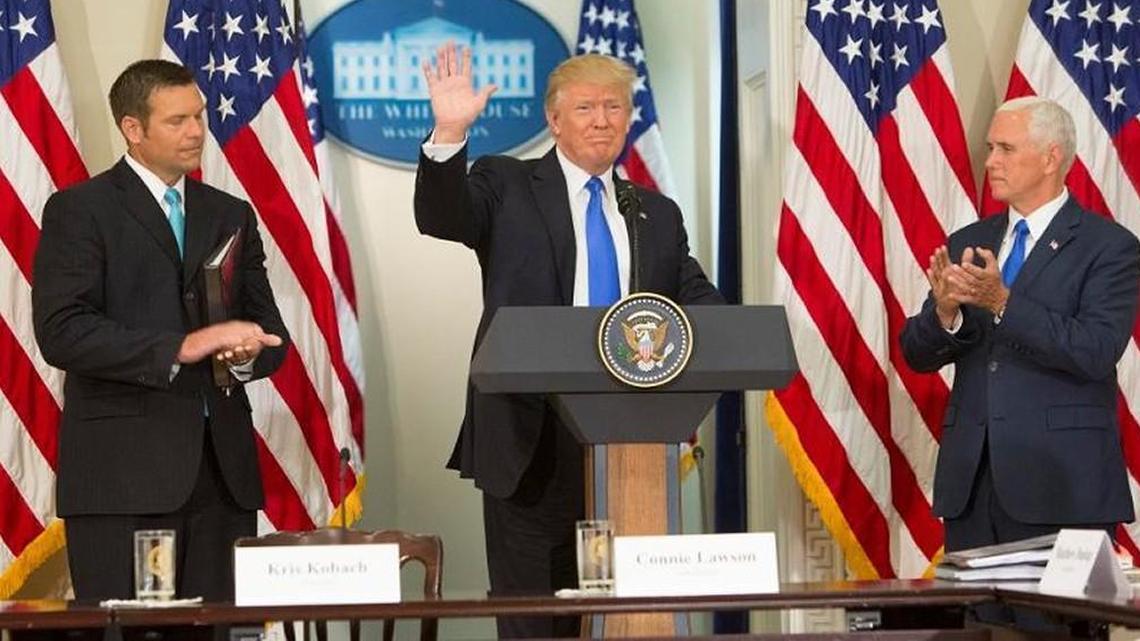 President Donald J. Trump departs after making remarks at the first meeting of the Presidential Advisory Commission on Election Integrity, flanked by the Commissions Vice Chairman Chris Kobach (left) and Chairman, U.S. Vice President Mike Pence (right) at The White House in Washington, in July.