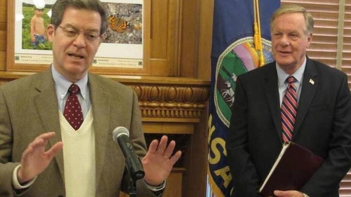 Nick Jordan (right) is leaving the administration of Gov. Sam Brownback.