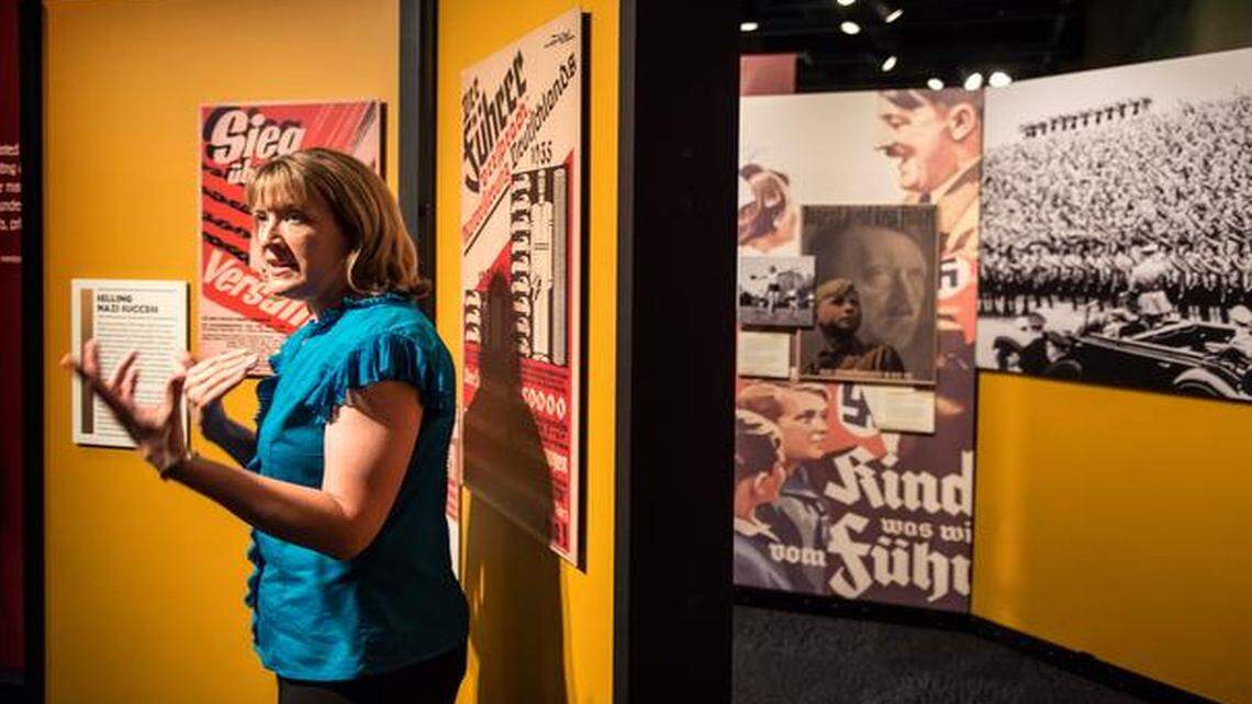 
Dee Harris, an archives specialist for the National Archives at Kansas City, explained the origins of some of the posters and other items on display in “State of Deception: The Power of Nazi Propaganda,” a traveling exhibit that opens Tuesday at the archives.
