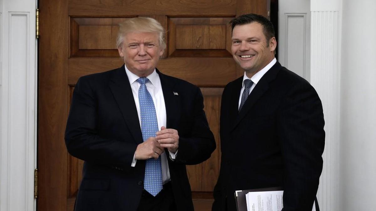 President-elect Donald Trump, and Kris Kobach posed for a photo last month at the clubhouse of Trump International Golf Club, in Bedminster Township, N.J. Kobach was carrying papers that included plans for the Department of Homeland Security.