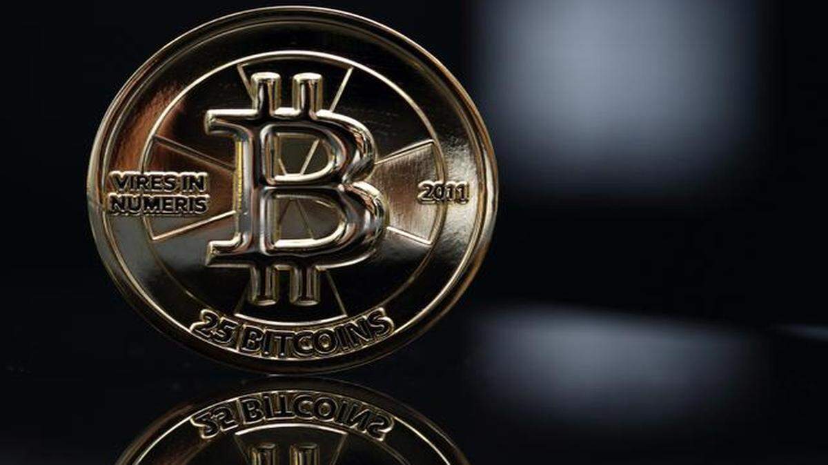 The Federal Trade Commission said it won a temporary restraining order against Butterfly Labs operator BF Labs Inc. and three individuals connected with the company. More than 20,000 consumers had bought computers from the company hoping to generate the virtual currency for themselves. The company said it will fight the federal action.