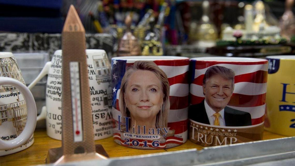 Coffee mugs with the images of Democratic presidential candidate Hillary Clinton and Republican presidential candidate Donald Trump wait to be sold in Washington, D.C.