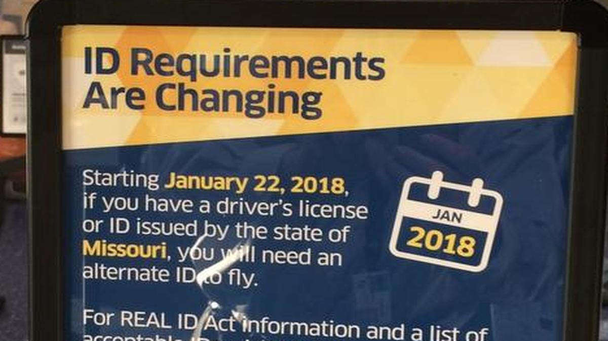 Signs posted at KCI airport warn Missouri passengers about future changes in identification requirements.