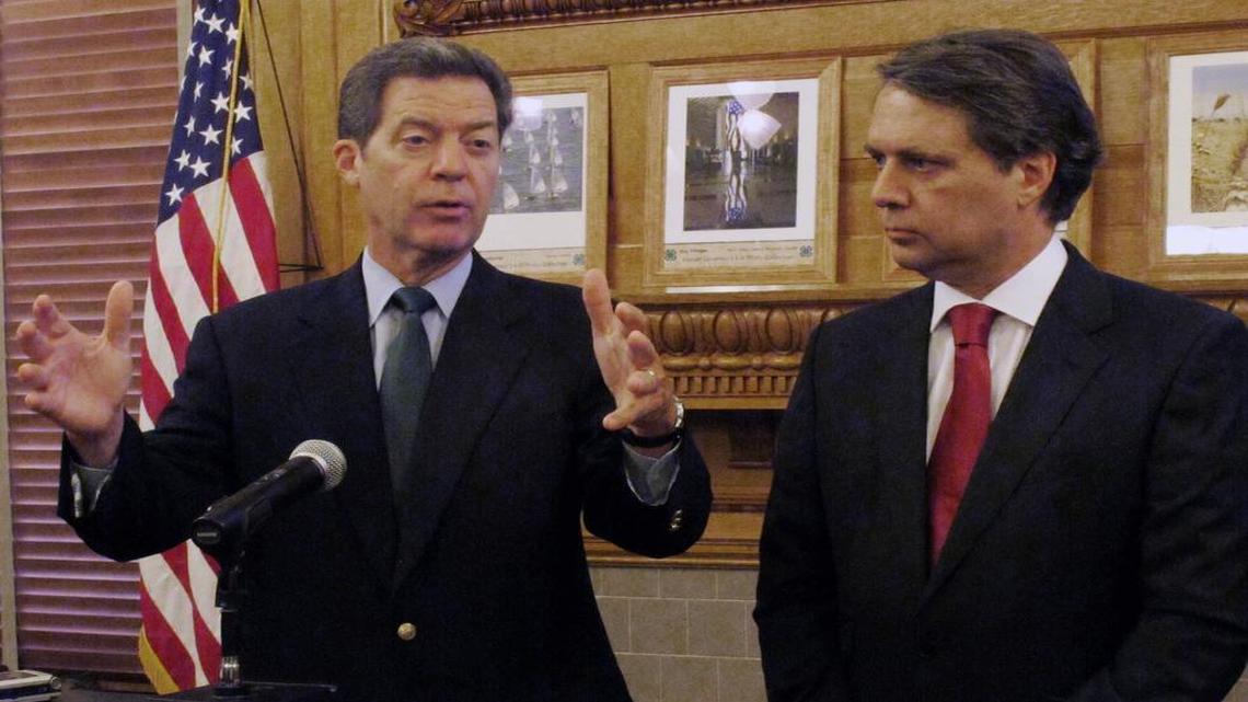 
Gov. Sam Brownback (left) and Lt. Gov. Jeff Colyer spoke at a news conference at the Kansas statehouse last September.
