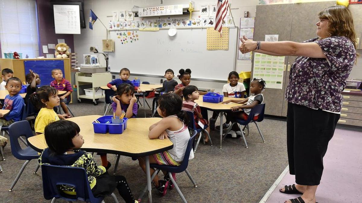
Faced with increased enrollment, including many new students who require special attention to keep up with grade-level lessons such as English language learners, Kansas City, Kan., schools are among dozens of districts across Kansas seeking Extraordinary Need Fund dollars from the state. At New Chelsea Elementary, kindergarten teacher Ruth DiSilvestro gave students a thumbs-up.
