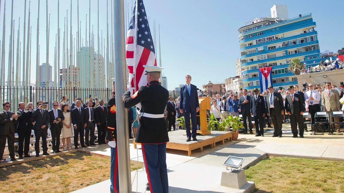 
Secretary of State John Kerry, and other dignitaries watch as U.S. Marines raise the U.S. flag over the newly reopened embassy in Havana, Cuba. Friday
