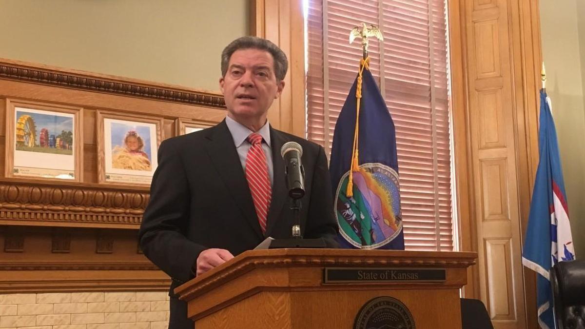 Gov. Sam Brownback talked to reporters Wednesday morning after vetoing a tax bill that supporters said would help solve the state’s budget woes.
