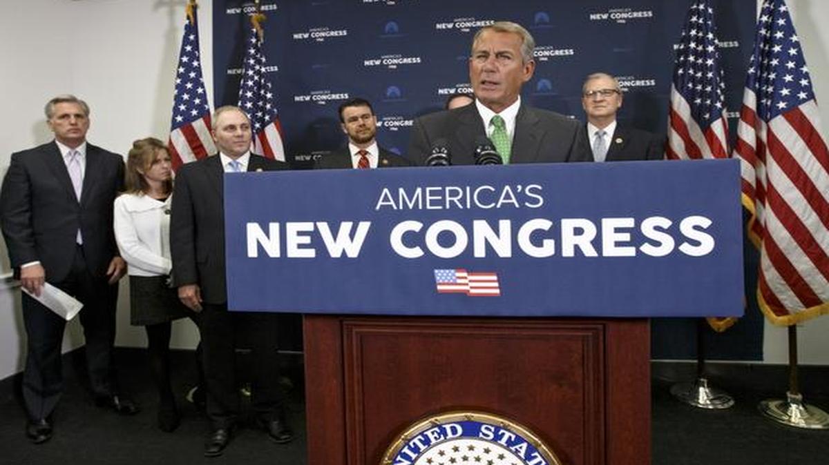 
House Speaker John Boehner of Ohio speaks after a House GOP caucus meeting on Capitol Hill in Washington, Wednesday. From left are, House Majority Leader Kevin McCarthy of Calif., Rep. Lynn Jenkins, R-Kansas, House Majority Whip Steve Scalise of La., Rep. Todd Young, R-Ind., Boehner, and Rep. Kevin Cramer, R-N.D. 
