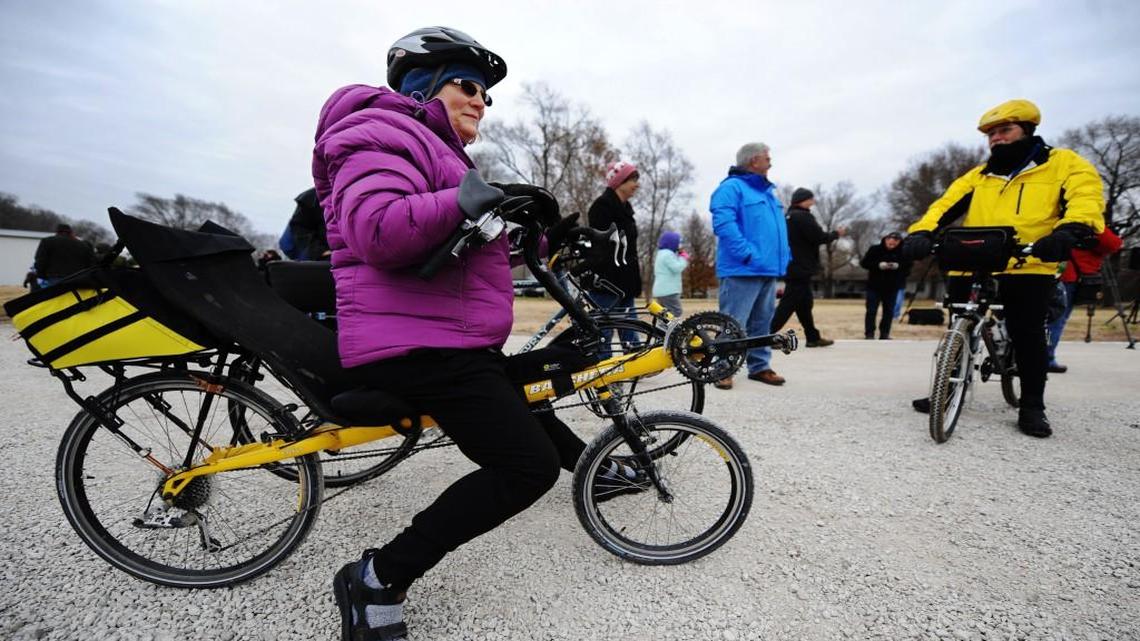 Cyclists Sharon Euler (left) of Gladstone and Greg Hoover of Raytown conversed with other cyclists prior to the grand opening of the latest section of the Katy Trail on Saturday in Pleasant Hill.